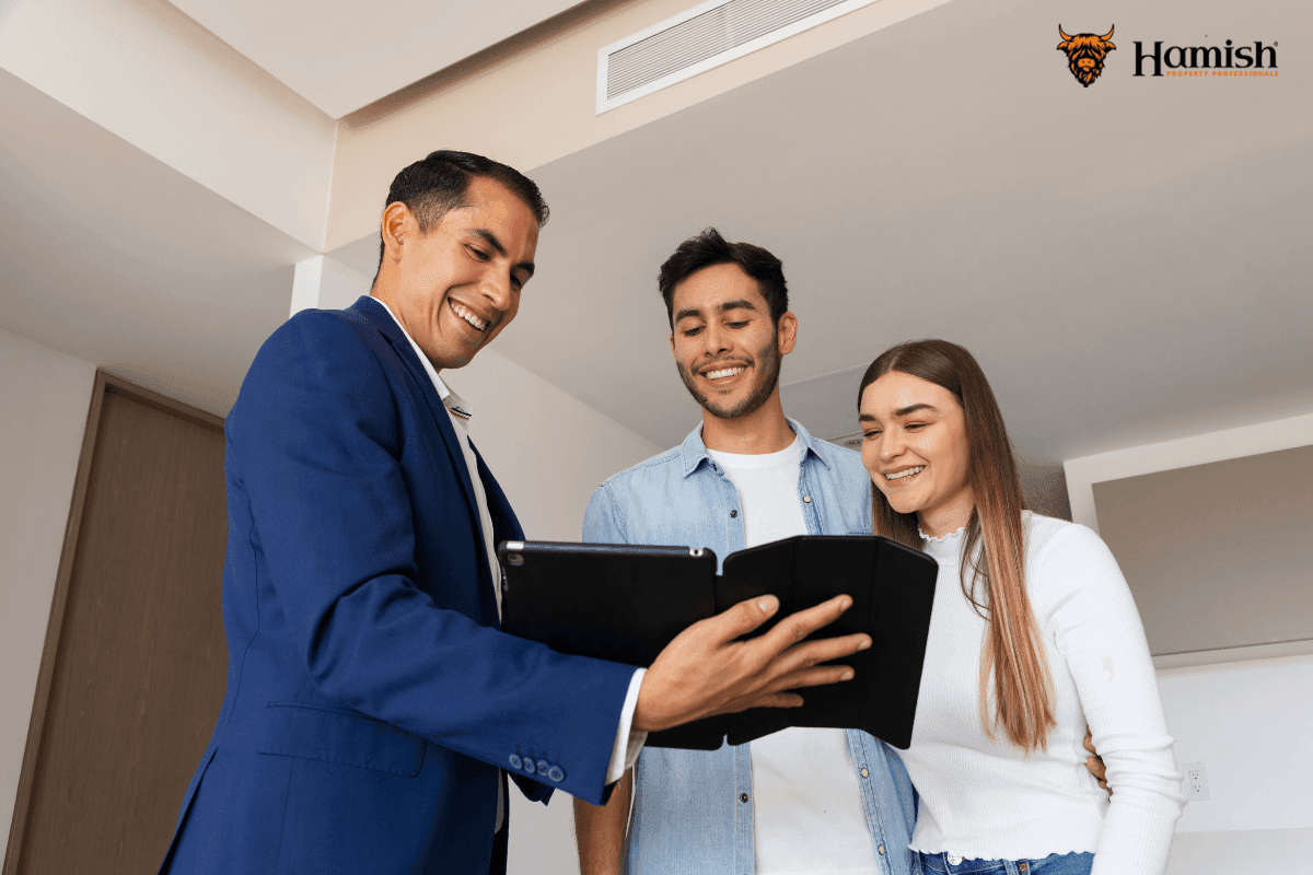 Agent discussing home sale with buyers